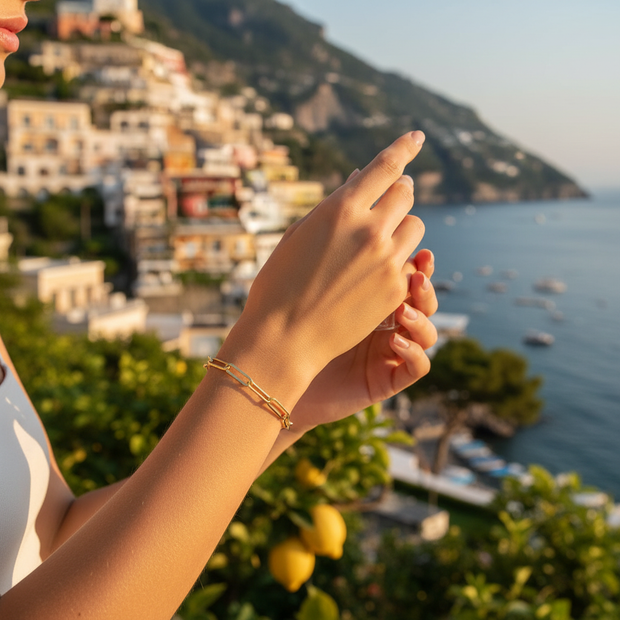 Delicate bracelet in Positano with pastel buildings and azure sea
