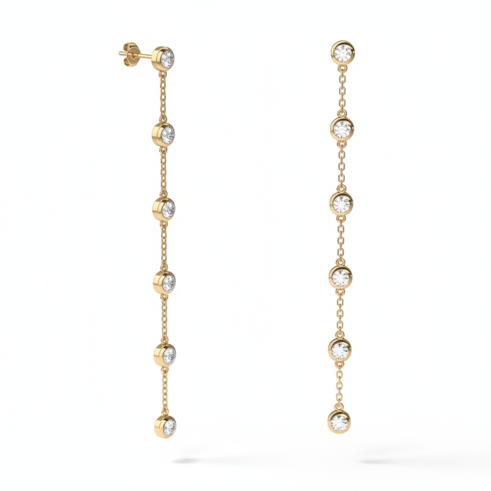 Gold drop earrings with white background